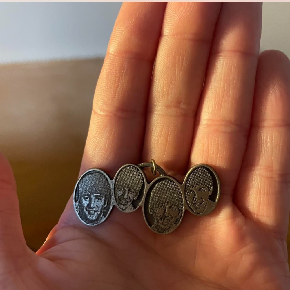 Silver Oval Pendant with Engraved Faces
